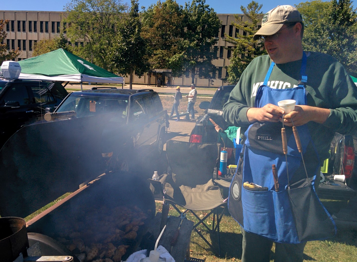 Grillmaster Phil at the Michigan State University Microbiology and Molecular Genetics departmental tailgate